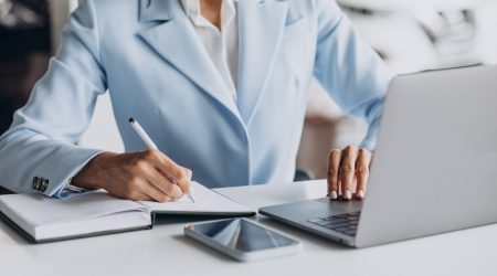 Business woman working in office on computer